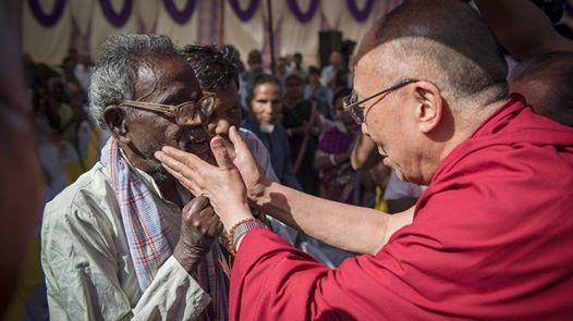 Photo: His Holiness the Dalai Lama affectionately reaches out to comfort a resident of the Tahirpur Leprosy Complex he visited in New Delhi, India on March 20, 2014. (Photo by Tenzin Choejor/OHHDL)